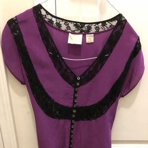 Falls purple silk blouse with black lace trim.
